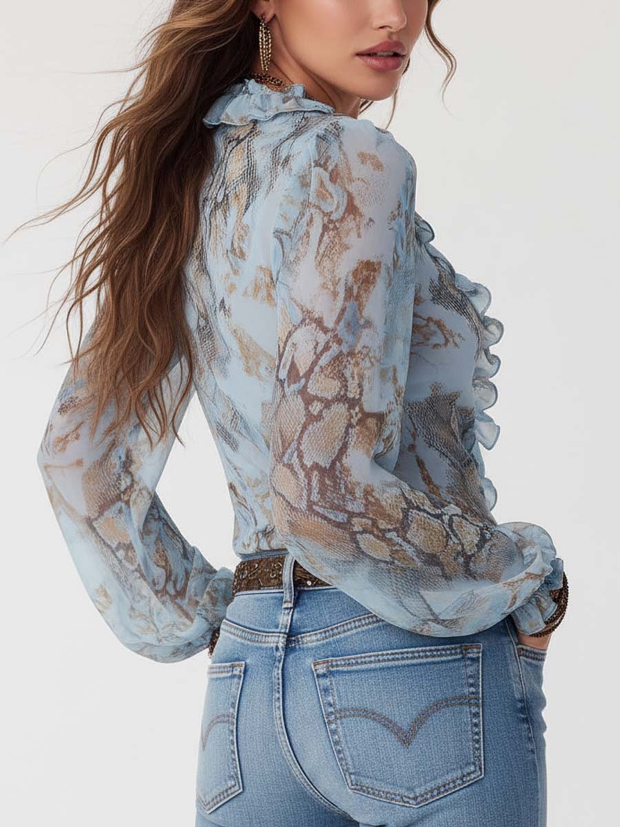 Kyra – Ruffled blouse with zipper in soft blue 1
